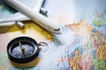 selective-focus-miniature-tourist-compass-map-with-plastic-toy-airplane-abstract-background-tr...jpg